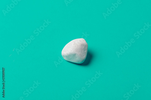White stone on aqua menthe color surface