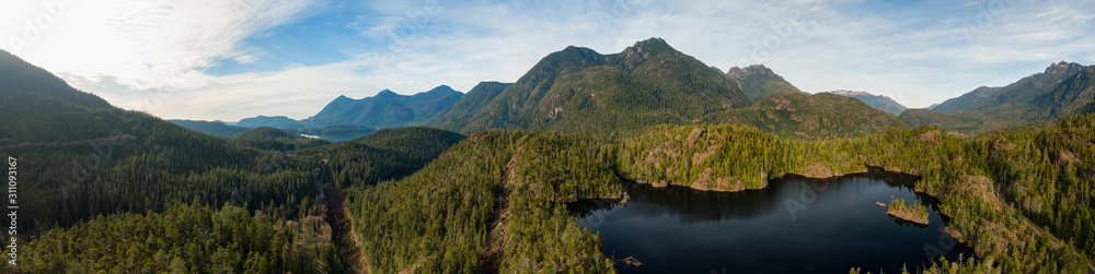 Beautiful Aerial Panoramic View of Larry Lake during a vibrant sunny day. Located on the West Coast of Vancouver Island near Tofino and Ucluelet, British Columbia, Canada.