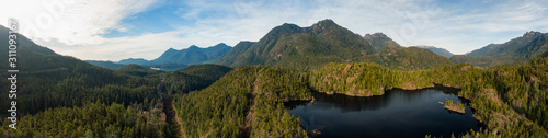 Beautiful Aerial Panoramic View of Larry Lake during a vibrant sunny day. Located on the West Coast of Vancouver Island near Tofino and Ucluelet  British Columbia  Canada.
