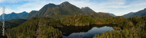 Beautiful Aerial Panoramic View of Larry Lake during a vibrant sunny day. Located on the West Coast of Vancouver Island near Tofino and Ucluelet, British Columbia, Canada.