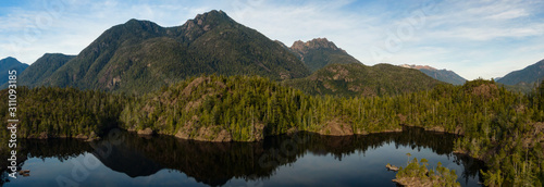 Fototapeta Naklejka Na Ścianę i Meble -  Beautiful Aerial Panoramic View of Larry Lake during a vibrant sunny day. Located on the West Coast of Vancouver Island near Tofino and Ucluelet, British Columbia, Canada.