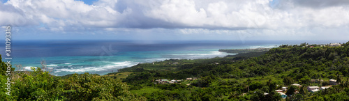 Beautiful Panoramic View of the Caribbean Sea from top of a hill during a sunny and cloudy day. Church View, Saint John, Barbados.