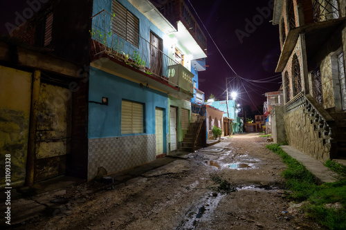 Fototapeta Naklejka Na Ścianę i Meble -  Trinidad, Cuba. Street view of a Residential neighborhood in a small Cuban Town during night time.