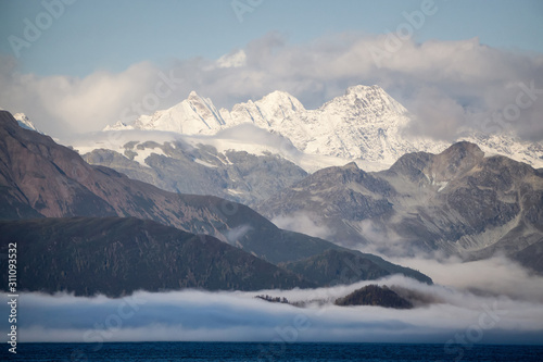 Beautiful View of American Mountain Landscape on the Ocean Coast during a cloudy and colorful sunrise in fall season. Taken in Glacier Bay National Park and Preserve, Alaska, USA. © edb3_16