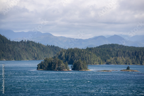 Northern Vancouver Island, British Columbia, Canada. Rocky Islands on the Pacific Ocean during a sunny and cloudy day with Islands and the Mainland in the background. © edb3_16