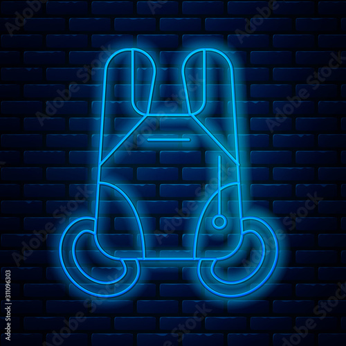 Glowing neon line Parachute icon isolated on brick wall background. Extreme sport. Sport equipment. Vector Illustration