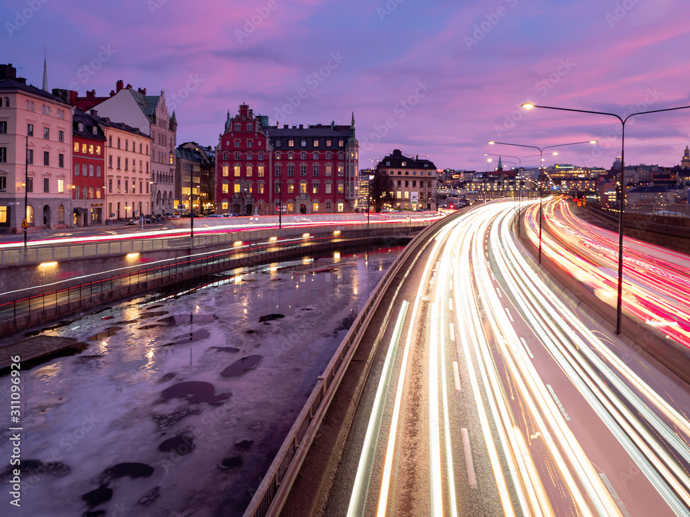 The evening traffic creates light streaks in central Stockholm
