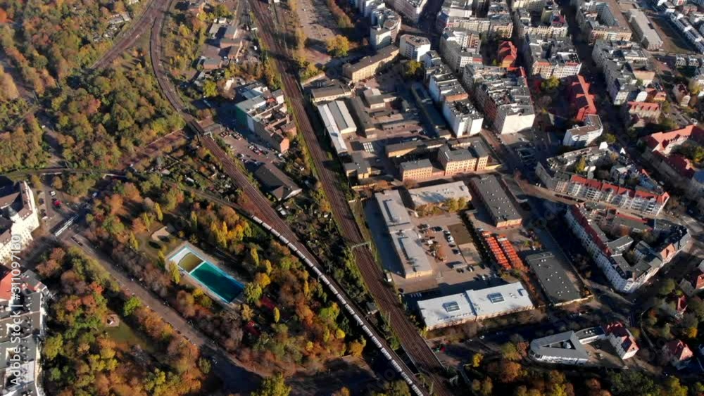 Freight train passing by small village in Magdeburg Germany, aerial Freight train passing by small village in Magdeburg Germany, aerial