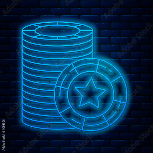 Glowing neon line Casino chips icon isolated on brick wall background. Casino gambling. Vector Illustration