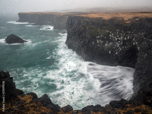 Violent waves crash onto the rocky cliffs of Snaefellsnes penninsula, Iceland