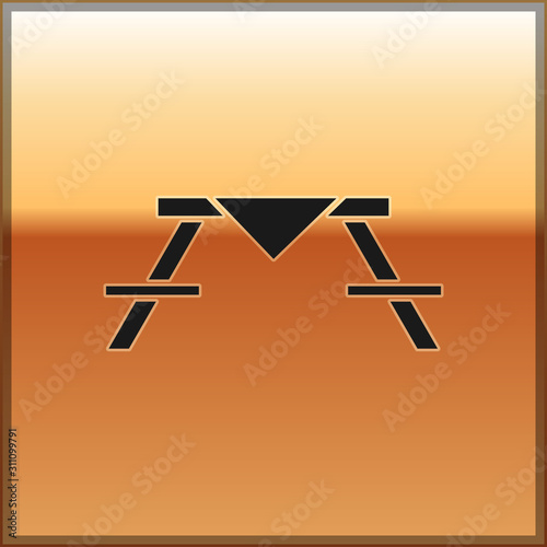 Black Picnic table with benches on either side of the table icon isolated on gold background.  Vector Illustration
