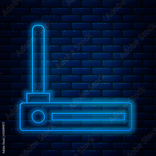 Glowing neon line Router and wi-fi signal symbol icon isolated on brick wall background. Wireless ethernet modem router. Computer technology internet. Vector Illustration