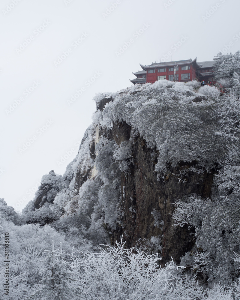 Thick frost covers both the mountain and the temple at the top of Mt Emei in Szechuan, China