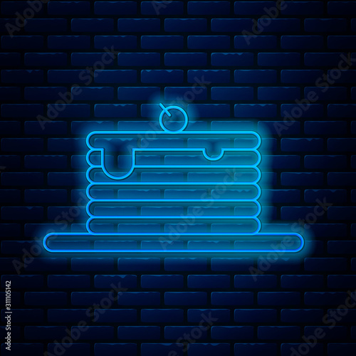 Glowing neon line Stack of pancakes icon isolated on brick wall background. Baking with syrup and cherry. Breakfast concept. Vector Illustration