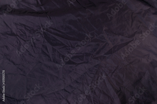 Dark satin material texture. Creative background.