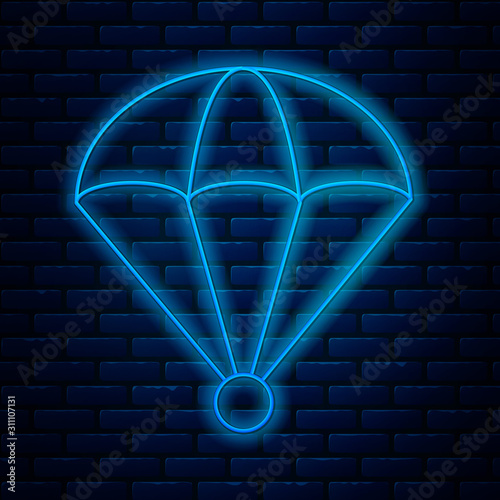 Glowing neon line Parachute icon isolated on brick wall background. Vector Illustration