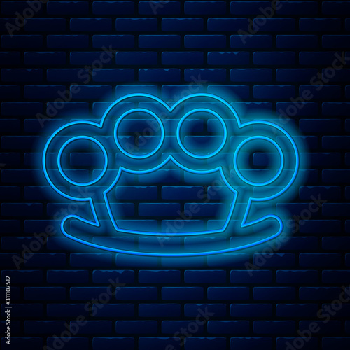 Glowing neon line Brass knuckles icon isolated on brick wall background. Vector Illustration