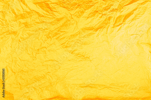 Yellow, orange, warm background. Creased paper texture.