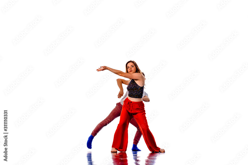 Stunning couple dancing in studio, portrait