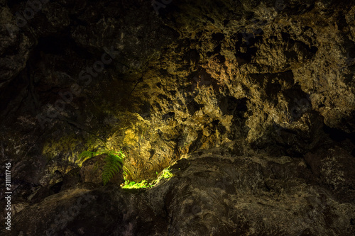 Illuminated lava tunnels in Sao Vicente Caves and Volcano Center. Result of the ancient volcanic eruption and magma flow now presented to tourists.