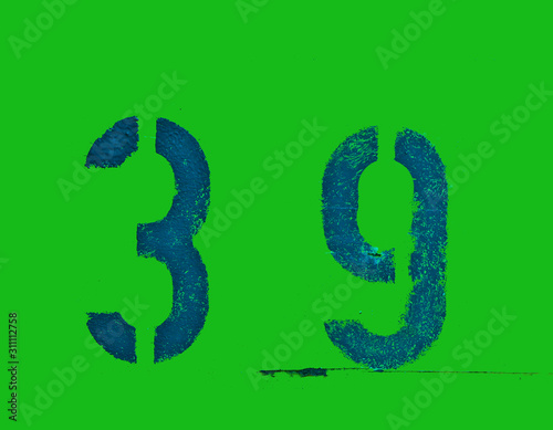 A house number plaque, showing the number thirty nine (39)