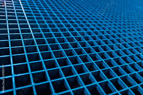 Background of squares of a blue metallic mesh.