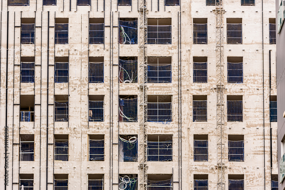 Detail of a building under construction with concrete walls. Detail of a building under construction with concrete walls.