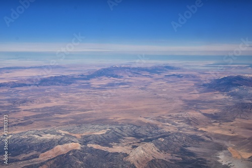 Colorado Rocky Mountains Aerial view from airplane of abstract Landscapes, peaks, canyons and rural cities in southwest Colorado and Utah. United States of America. USA.