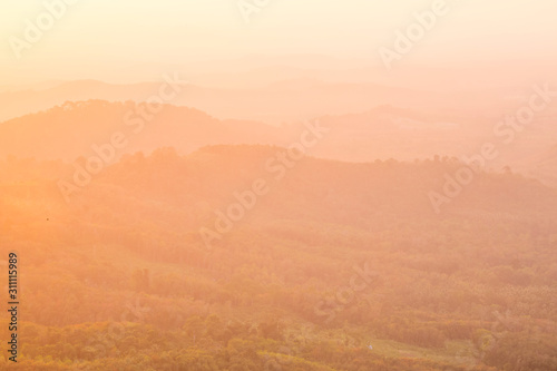 Beautiful Landscape of mountain layer in morning sun ray and winter fog at Doi Hua Mae Kham, Mae Salong Nai, Chiangrai, Thailand