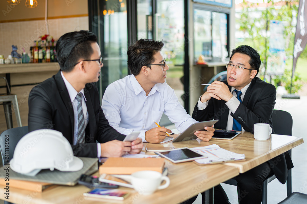 three businessman meeting and talk about business plan, marketing and financial in the future. concept of business success three businessman meeting and talk about business plan, marketing and financial in the future. concept of business success