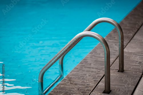 Swimming pool with stair at roof top condo © JokimiyaPhoto