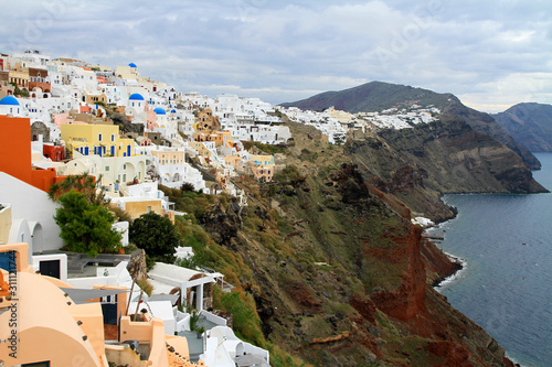 Glancing over the cliffs of Santorini, Greece, on an overcast day