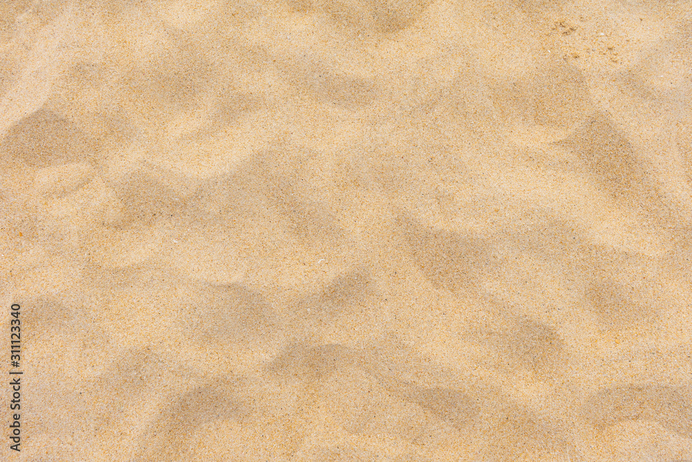 Closeup shot of sand texture on the beach as background Closeup shot of sand texture on the beach as background