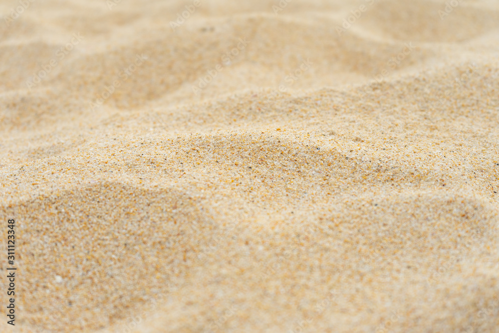 Closeup shot of sand texture on the beach as background Closeup shot of sand texture on the beach as background