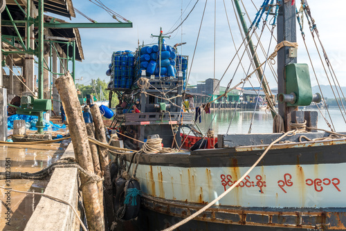 Fishing trawler is moored at the Tai Kak Pier in the industrial estate of the Ranong harbor