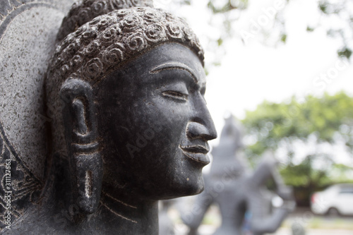 Close up face of Gauthama Buddha Statue, Mahabalipuram, India 2018 photo