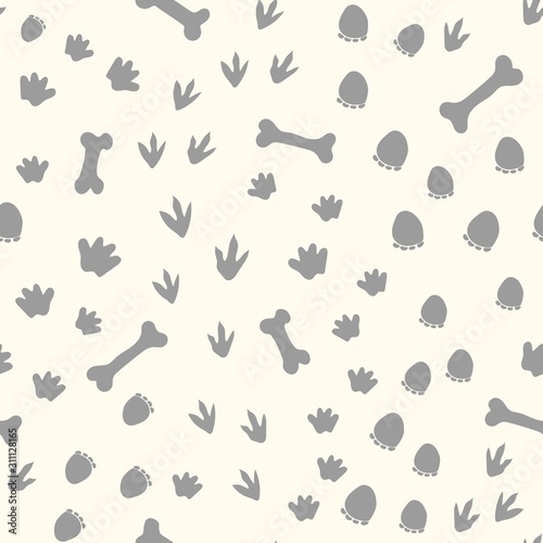 Allover seamless repeat pattern with different shape gray dinosaur tracks and bones tossed on an ivory background