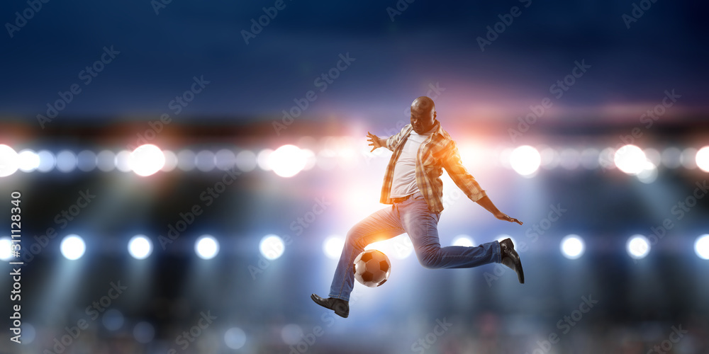 Soccer man in action with ball. Mixed media Soccer man in action with ball. Mixed media