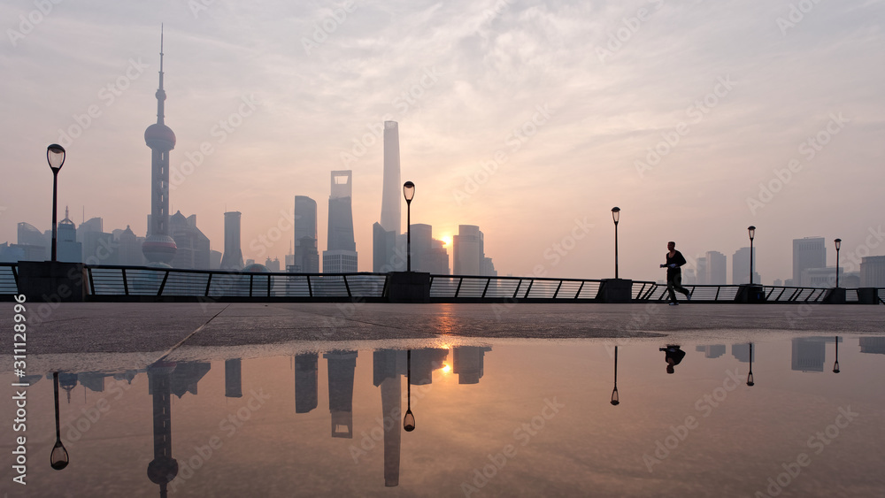 Silhouette morning runner running at famous bund zone with sun rising shanghai city background.	 - obrazy, fototapety, plakaty 