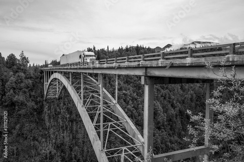 bridge with truck crossing it 