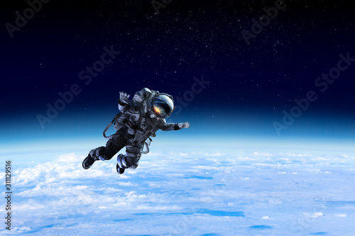 Fototapeta Naklejka Na Ścianę i Meble -  Astronaut on space mission . Mixed media