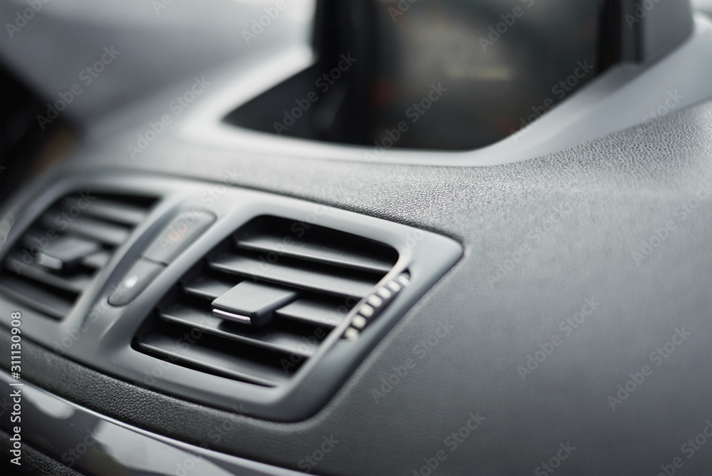 air conditioner ventilation grille in the car. Climate control panel