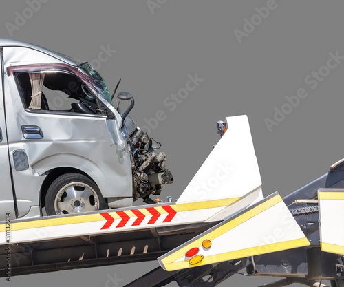 accident Car Slide on truck for move. van car have damage by accident on road take with slide truck move . Isolated on gray background