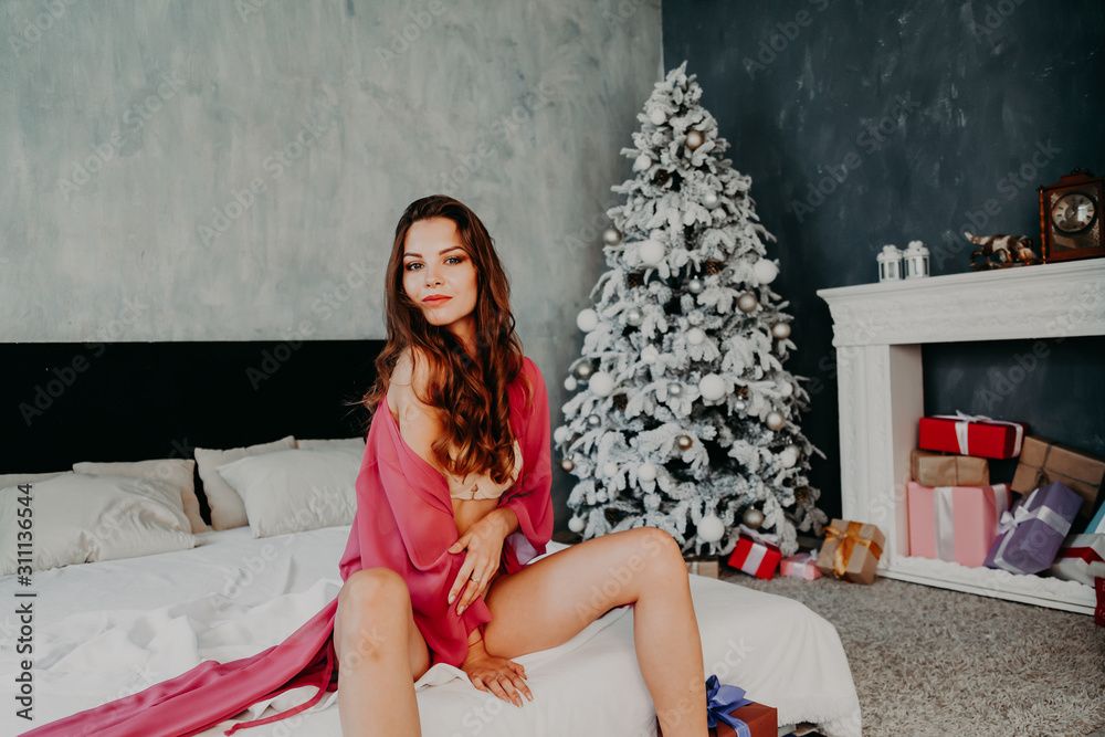 Fototapeta premium Portrait of beautiful fashionable women in underwear in the bedroom on the bed
