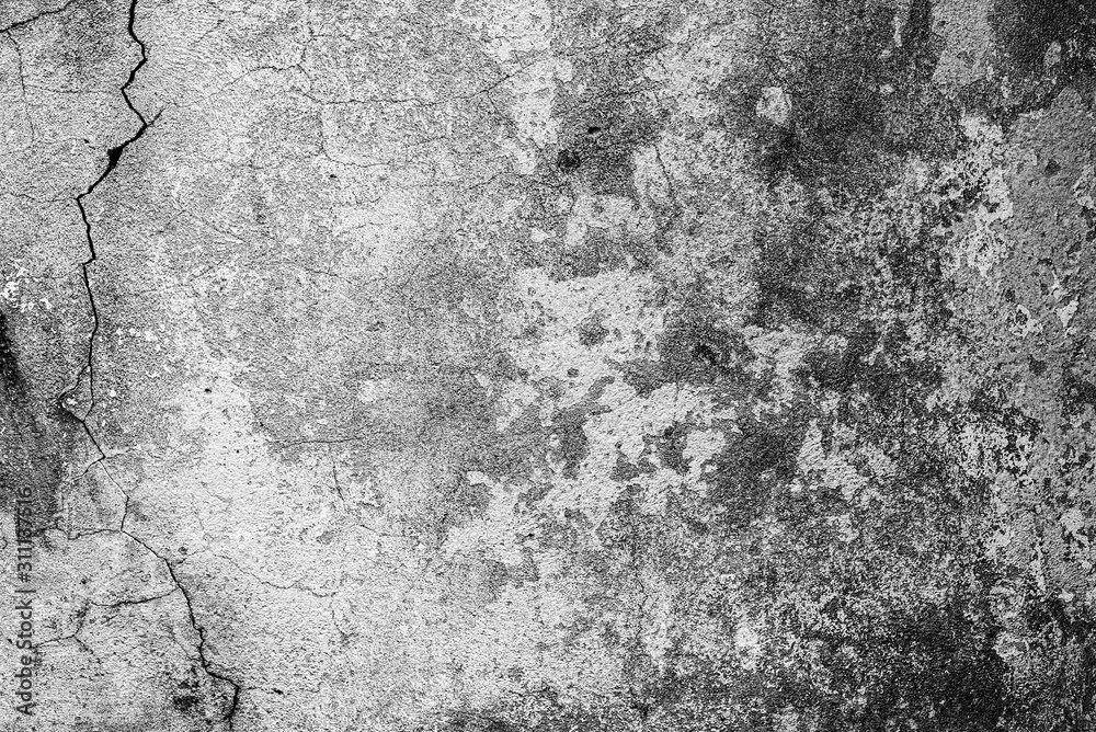 Fototapeta premium Texture of a concrete wall with cracks and scratches which can be used as a background