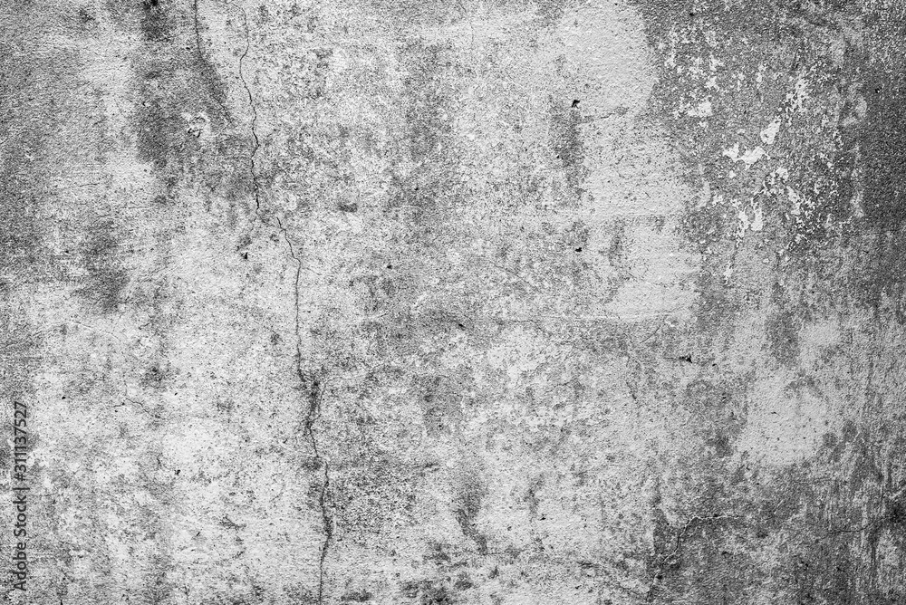 Fototapeta premium Texture of a concrete wall with cracks and scratches which can be used as a background