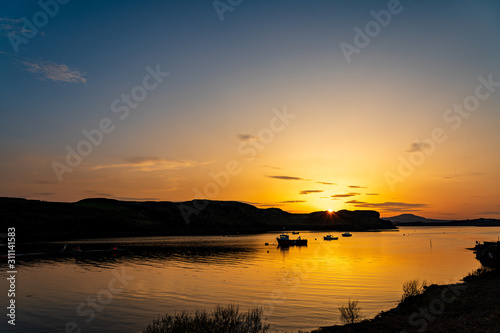 bay ocean fishing boats sunset landscape