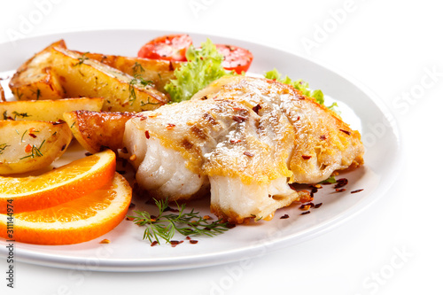 Fish dish - grilled herrings with vegetables