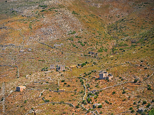 Wallpaper Mural Mountainous field with old walls and towers buildings remains in Mani, Peloponnese, Greece. Torontodigital.ca