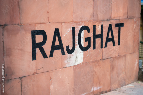 Sign for Raj Ghat, the burial site and memorial of Mahatma Gandhi, where he was creamated